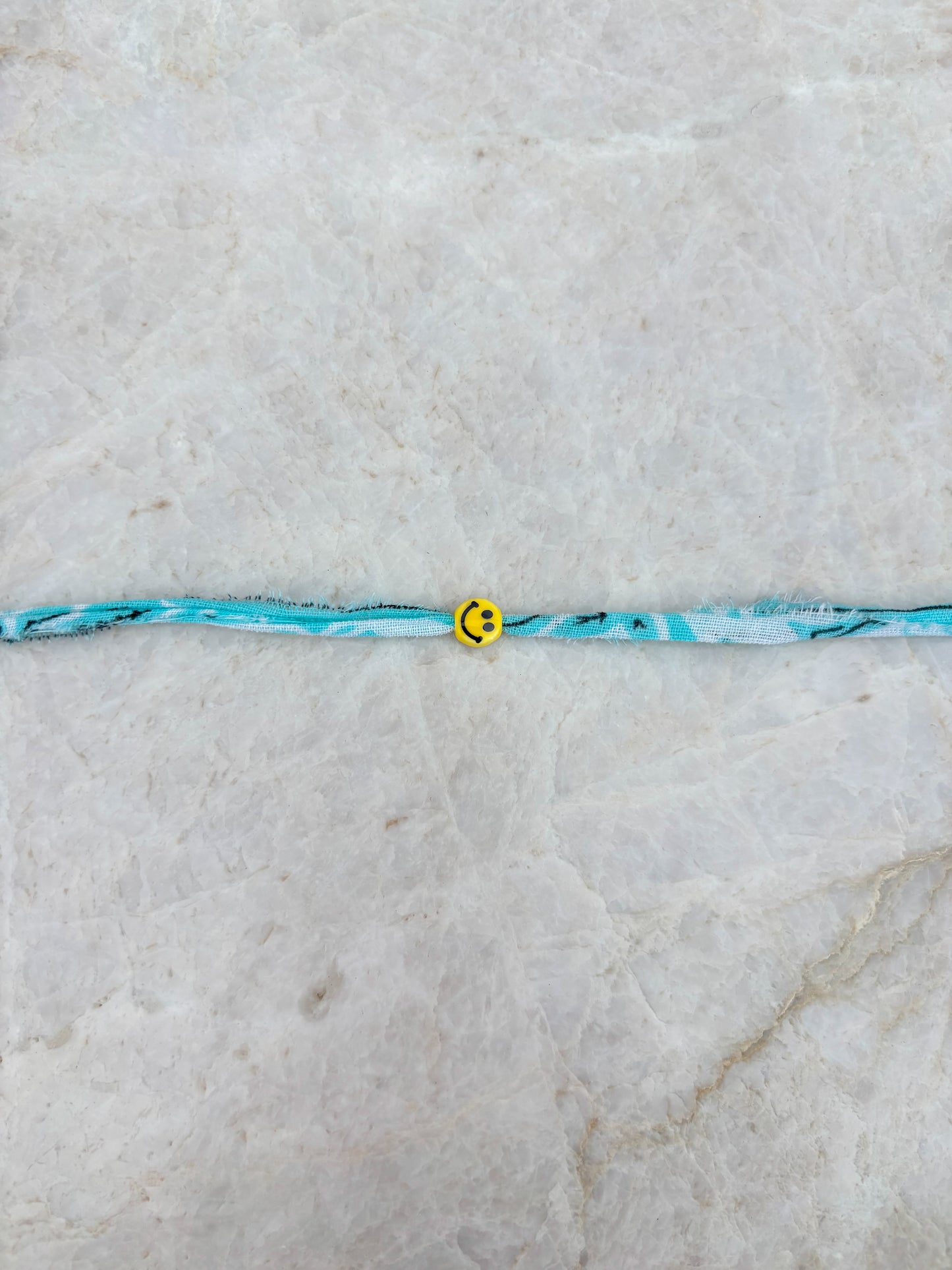 Smiley armband - lichtblauw