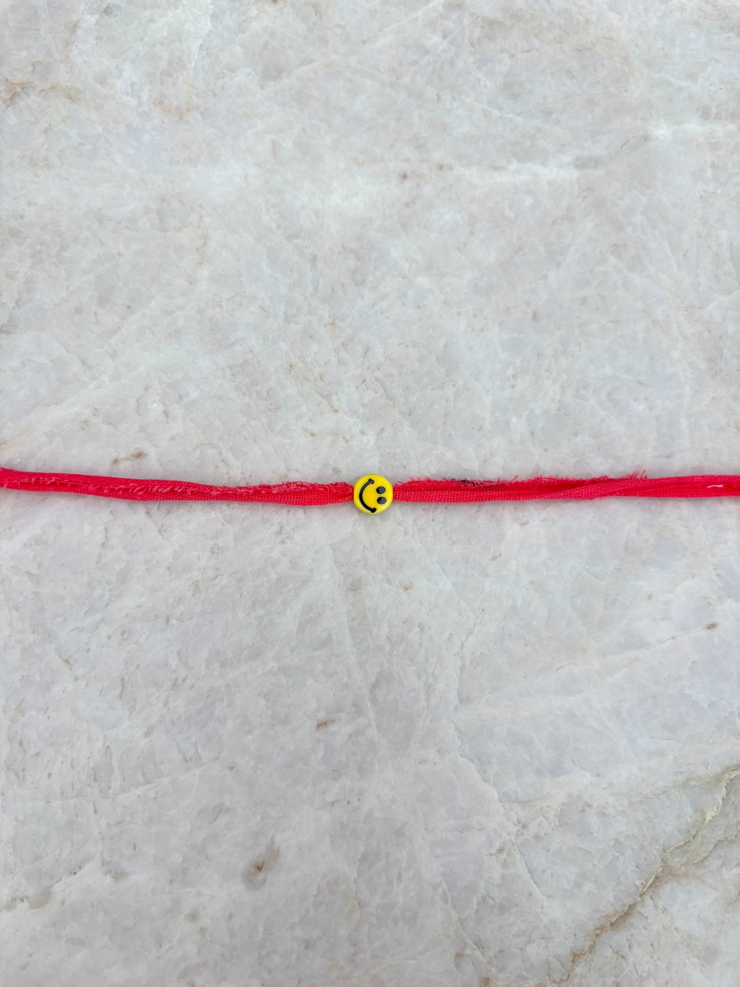 Smiley armband - koraal